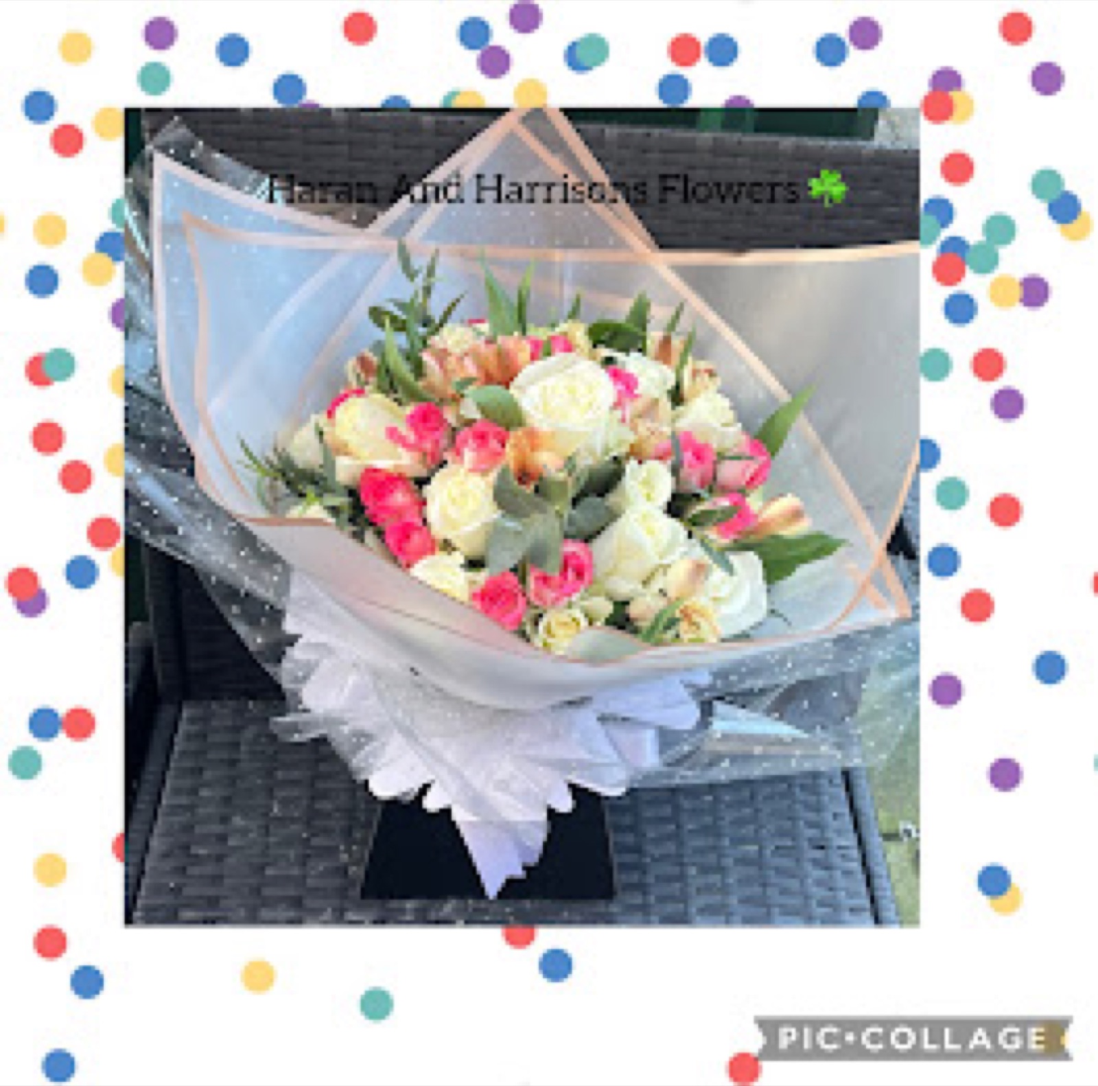 Wrapped bouquet of pink and cream roses